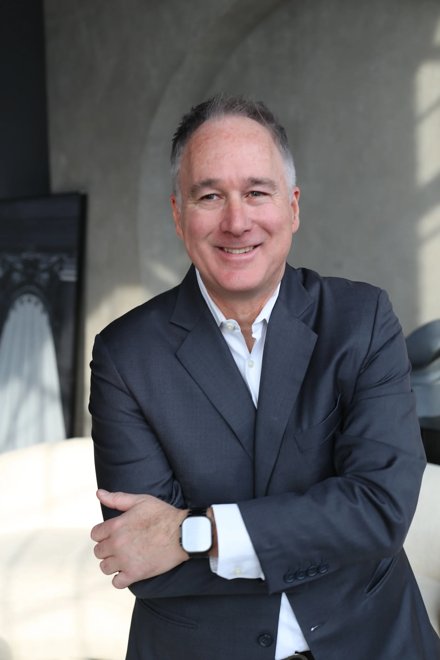 Man in a Suit with Arms Crossed The Narrative Group.