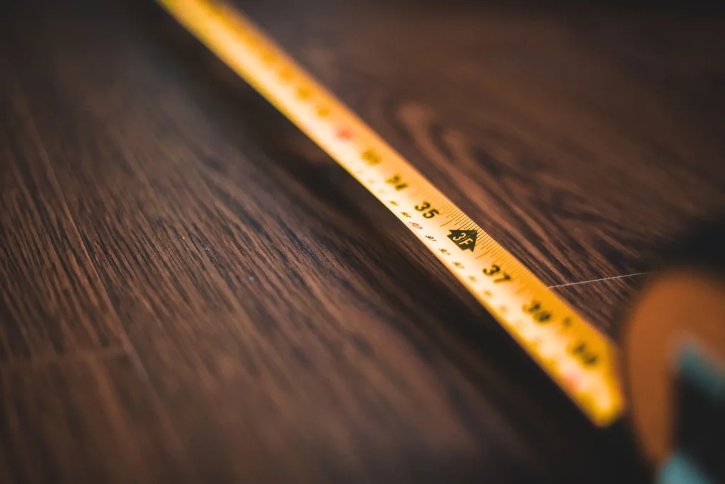 Close-up of a yellow pencil across wood, suggesting it cost reduction planning and more controlled budgets.